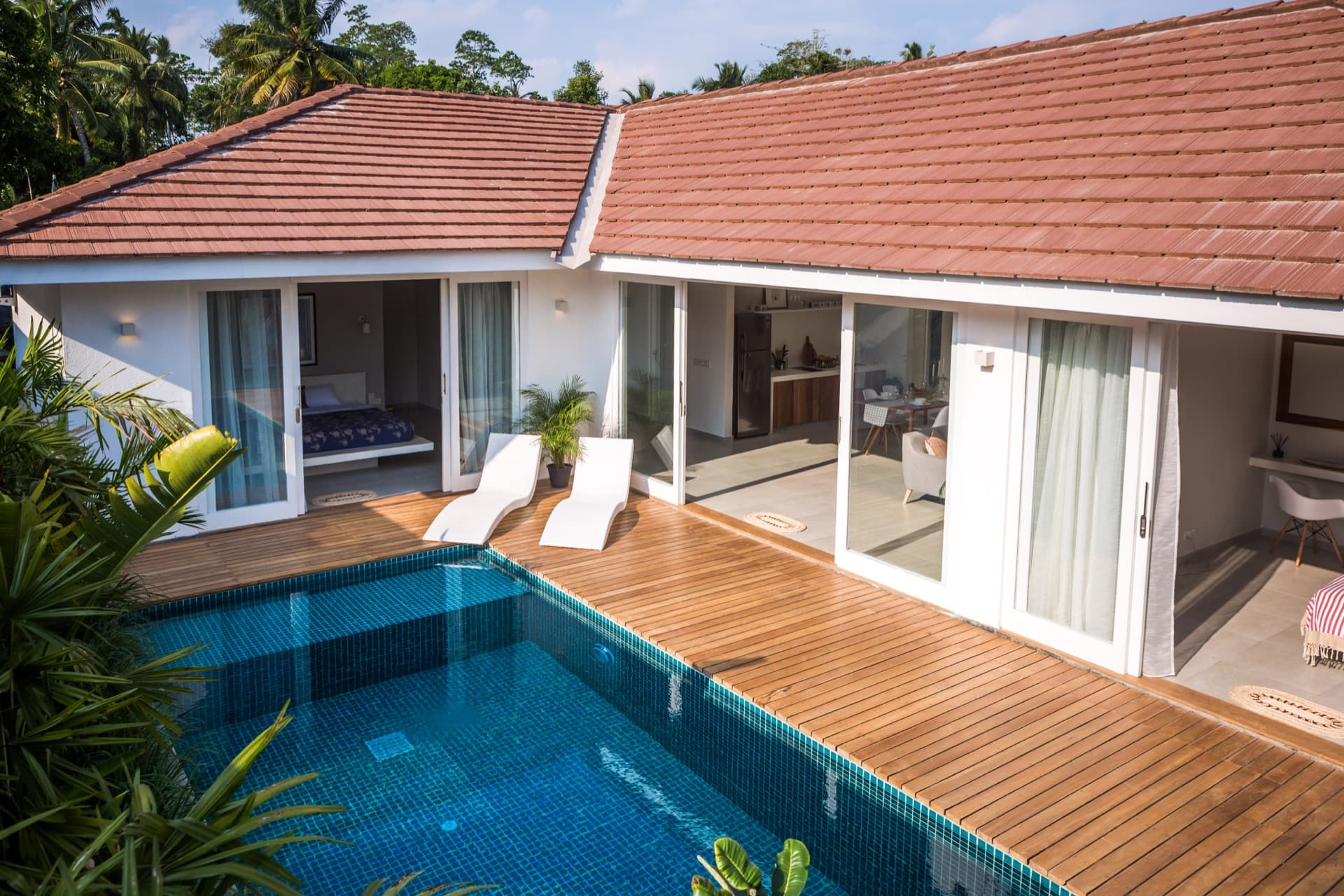 Villa terrace with sun loungers next to a private pool in Ahangama