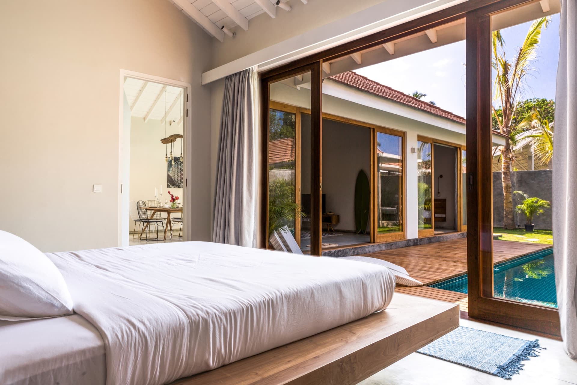 Bedroom of a Good Story villa with a view of the garden